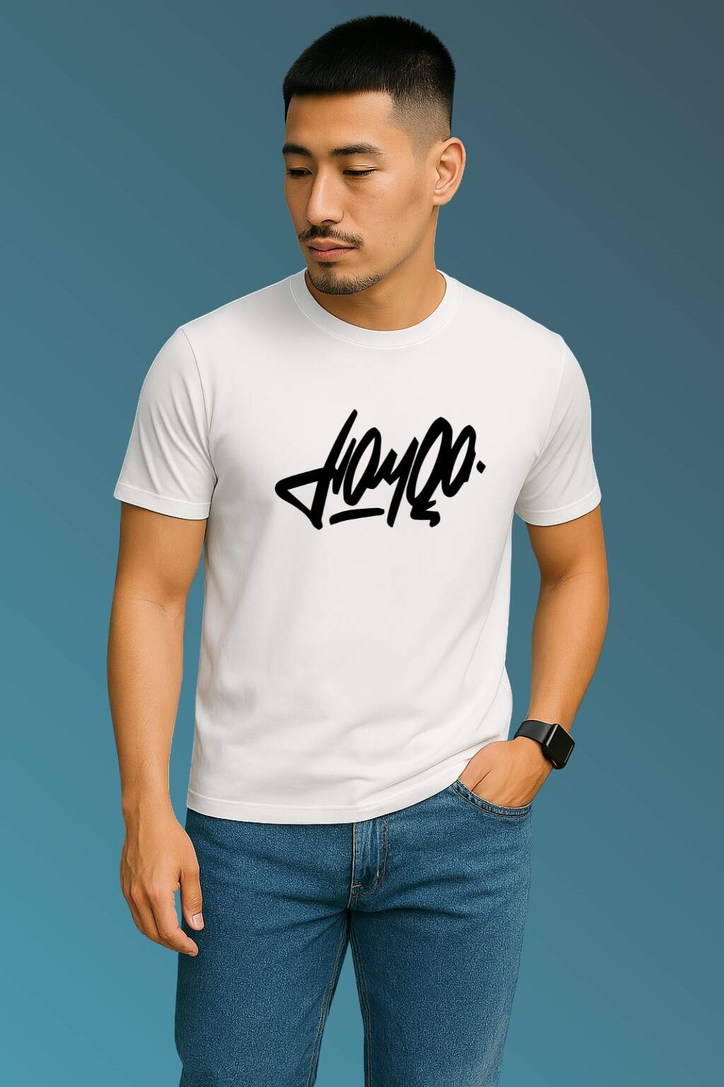 t-shirt featuring bold black stylized typography, worn with blue denim jeans and brown casual shoes. Set against a smooth blue gradient backdrop, the photo highlights modern streetwear style in a minimal, fashion-forward composition."